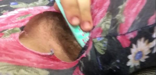  Ripped hole reveals a pissing and squirting little pussy